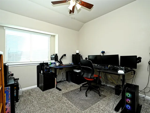 a view of a workspace with furniture