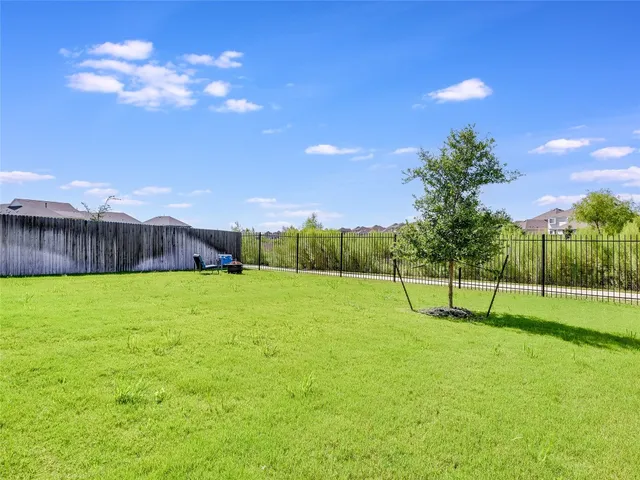 a front view of a house with a yard and porch