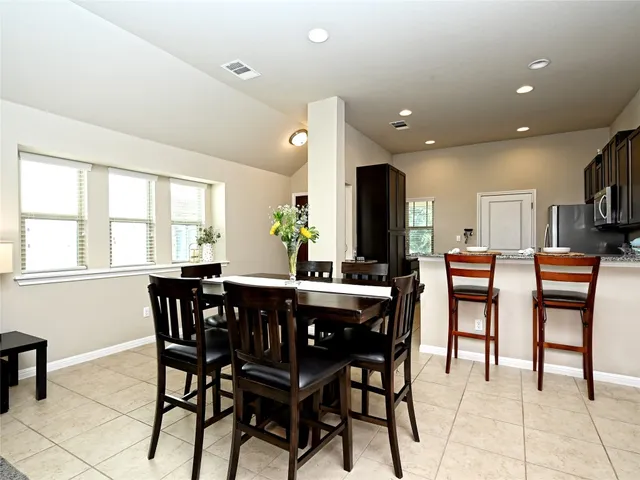 a view of a dining room with furniture window and outside view