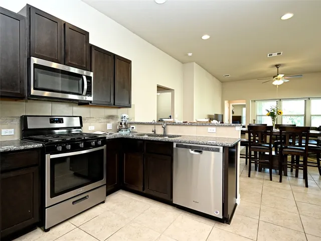 a view of a dining room with furniture and window