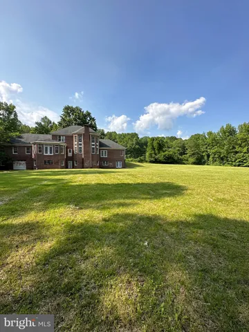 a view of a building with a big yard