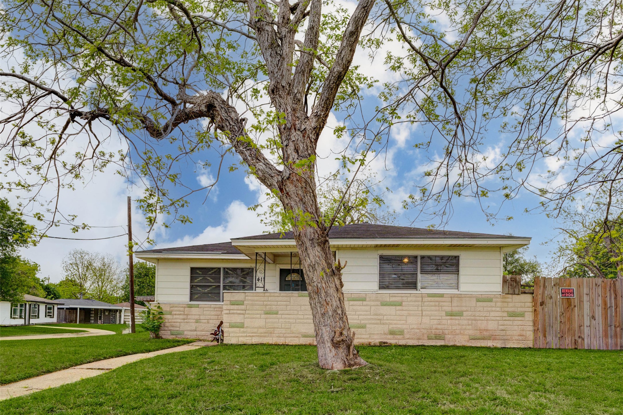 411 Burke Road Pasadena, TX 77506 - Photo 3 of 24 front view of a house with a yard