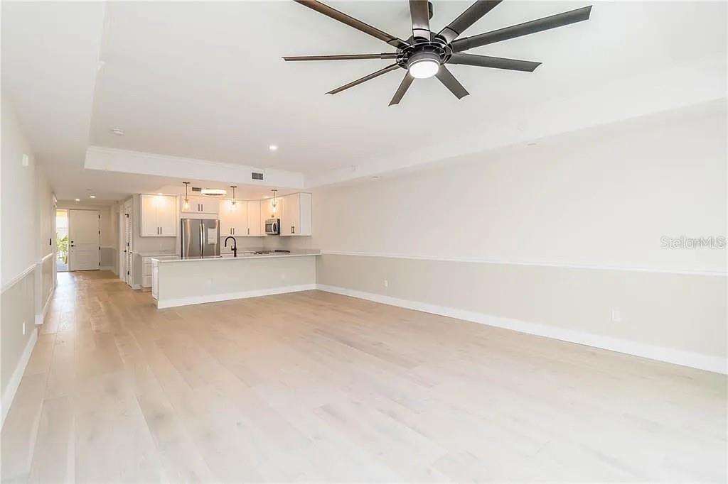 Undisclosed Address Osprey, FL 34229 - Photo 11 of 39 a view of a kitchen with a sink and dishwasher