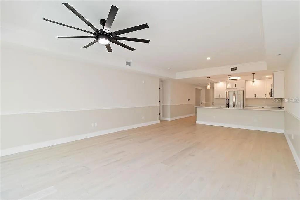 Undisclosed Address Osprey, FL 34229 - Photo 12 of 39 a view of a livingroom with a ceiling fan and window