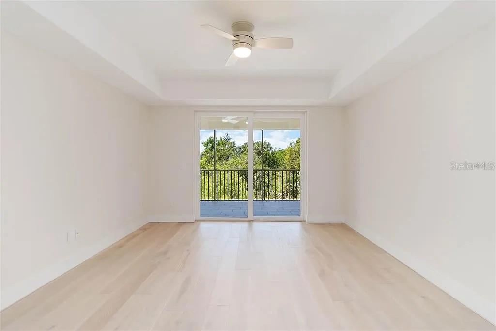 Undisclosed Address Osprey, FL 34229 - Photo 13 of 39 an empty room with a window