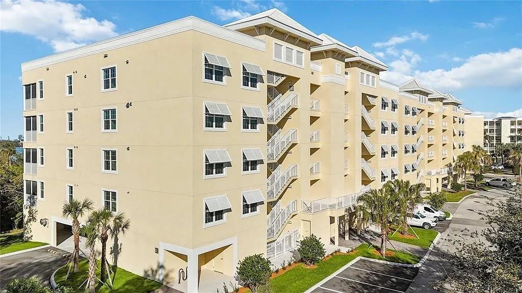 Undisclosed Address Osprey, FL 34229 - Photo 2 of 39 a large building with a lot of windows