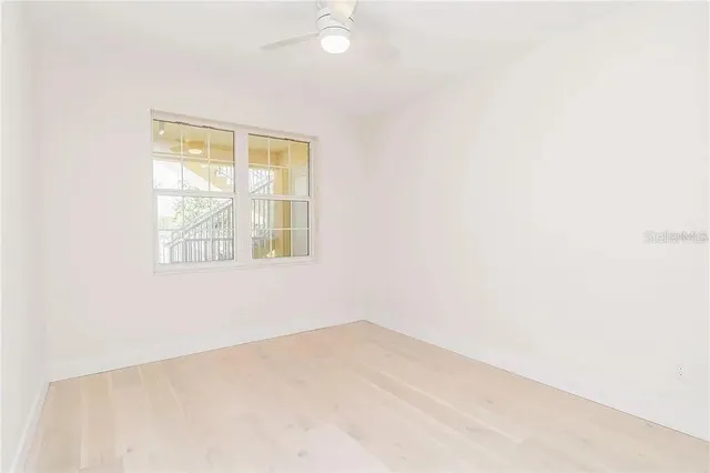 a utility room with cabinets washer and dryer