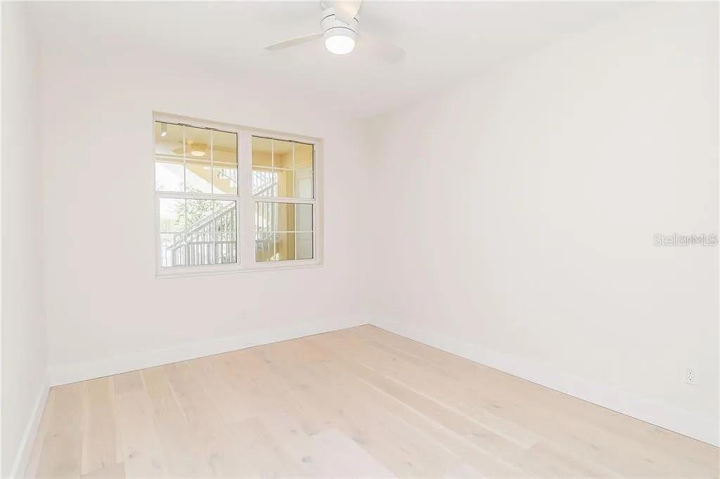 Undisclosed Address Osprey, FL 34229 - Photo 26 of 39 an empty room with windows