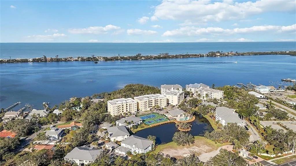 Undisclosed Address Osprey, FL 34229 - Photo 35 of 39 a view of a lake with couches and city view