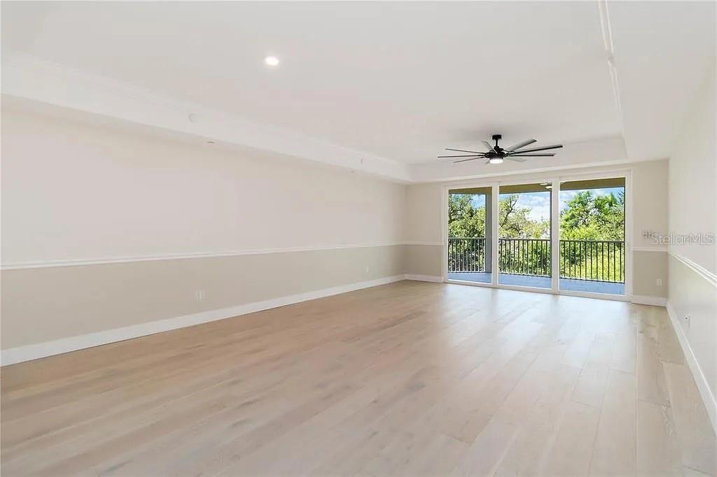 Undisclosed Address Osprey, FL 34229 - Photo 9 of 39 wooden floor in an empty room with a window
