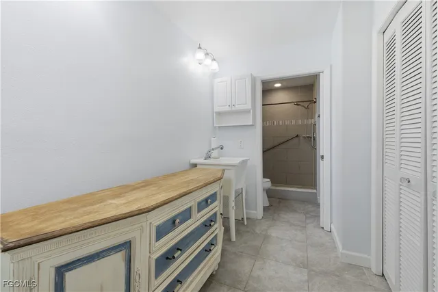 a utility room with a sink a washer and dryer