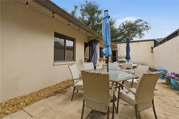 a view of a swimming pool with an outdoor seating