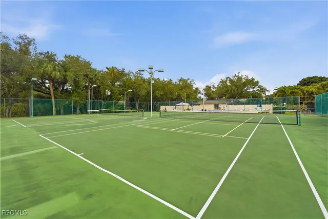 a view of a terrace with a garden and trees