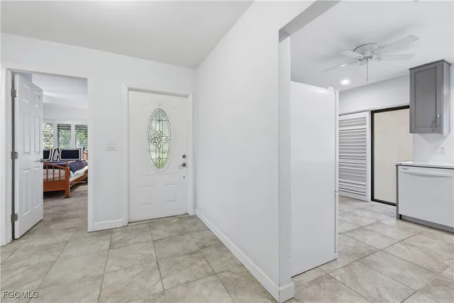 a view of a hallway to rooms and stairs