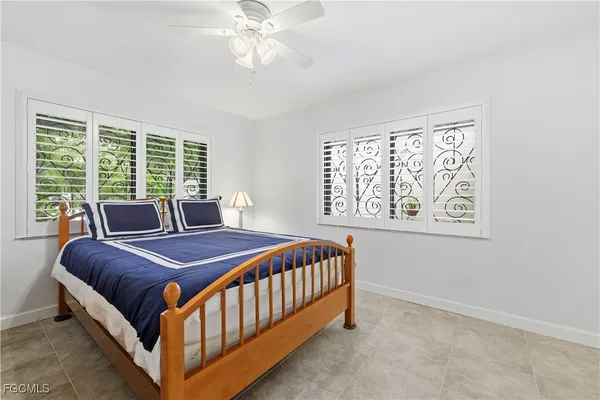 a bedroom with a bed and a mirror