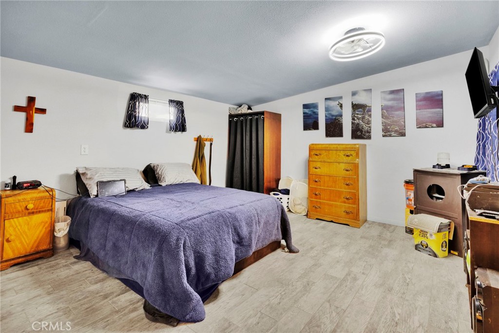 25333 Valley View Road Apple Valley, CA 92308 - Photo 15 of 37 a bedroom with bed and ceiling fan