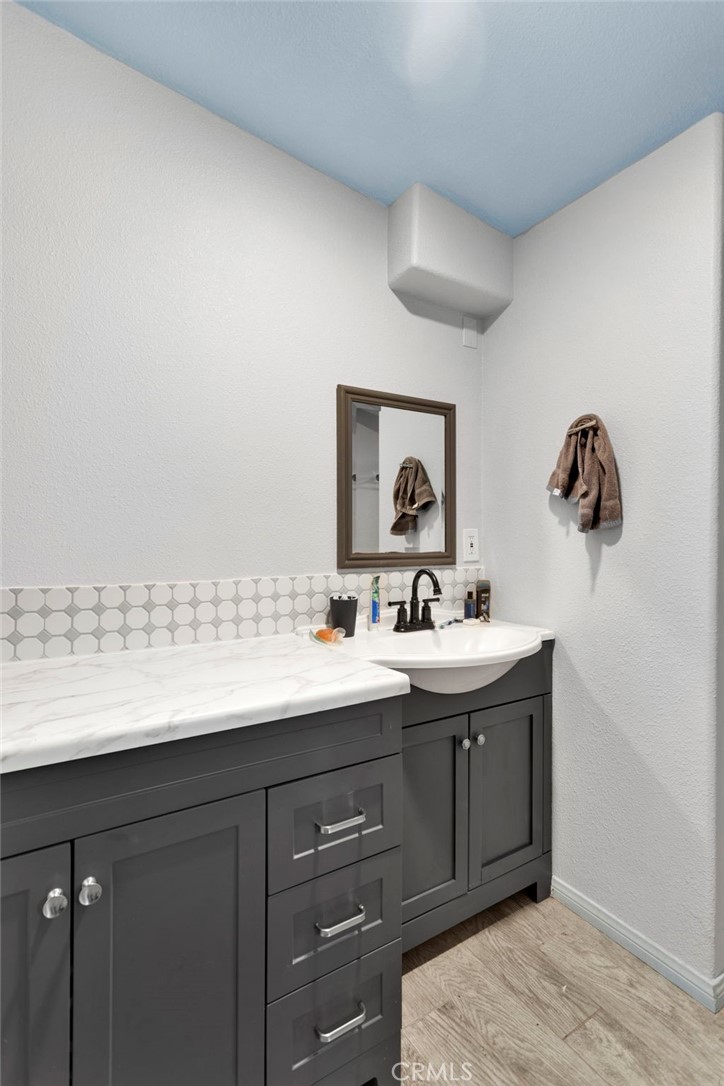 25333 Valley View Road Apple Valley, CA 92308 - Photo 18 of 37 a bathroom with a sink and a mirror