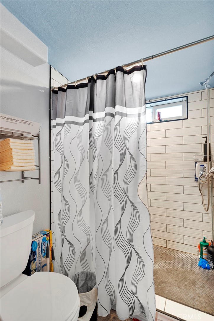 25333 Valley View Road Apple Valley, CA 92308 - Photo 19 of 37 a bathroom with a sink toilet and shower