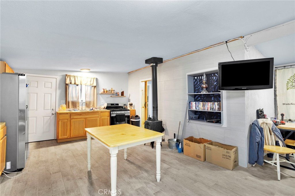 25333 Valley View Road Apple Valley, CA 92308 - Photo 8 of 37 a living room with furniture and a flat screen tv