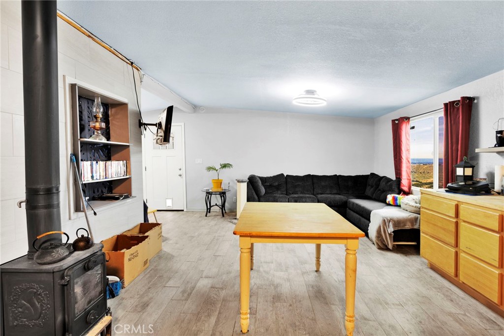 25333 Valley View Road Apple Valley, CA 92308 - Photo 9 of 37 a living room with furniture and a flat screen tv