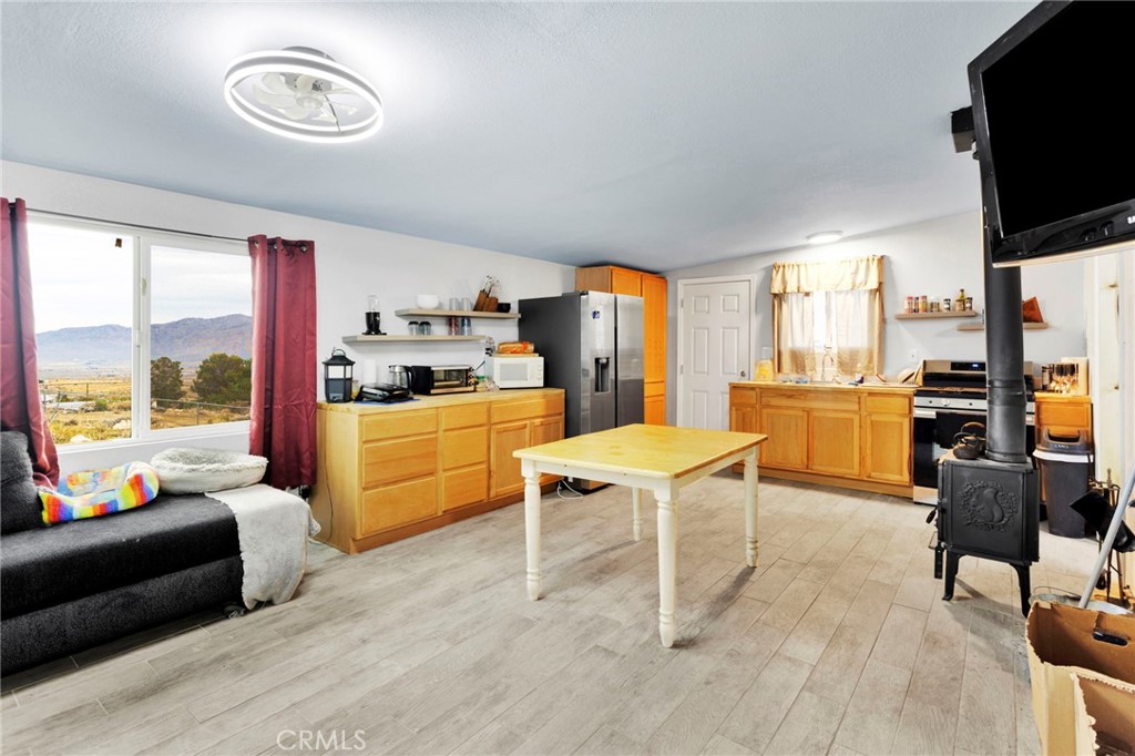 25333 Valley View Road Apple Valley, CA 92308 - Photo 10 of 37 a living room with furniture and a flat screen tv