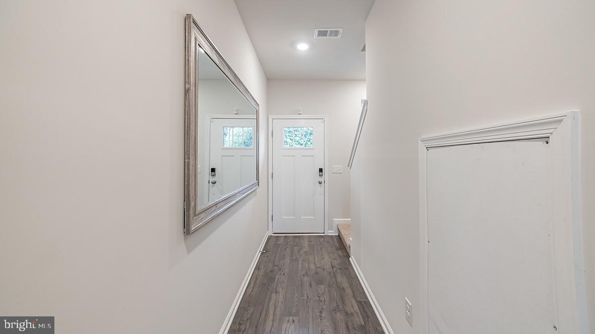 87 Alexander Way Westampton, NJ 08060 - Photo 17 of 23 a view of a hallway with wooden floor and staircase