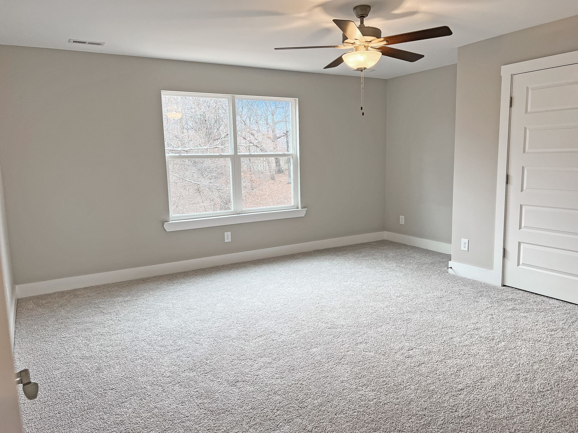 5140 Starks Road Cross Plains, TN 37049 - Photo 15 of 17 an empty room with a window and a fan