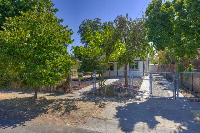 a view of a backyard with sitting area