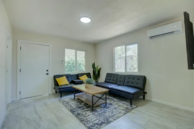 a living room with furniture and a window