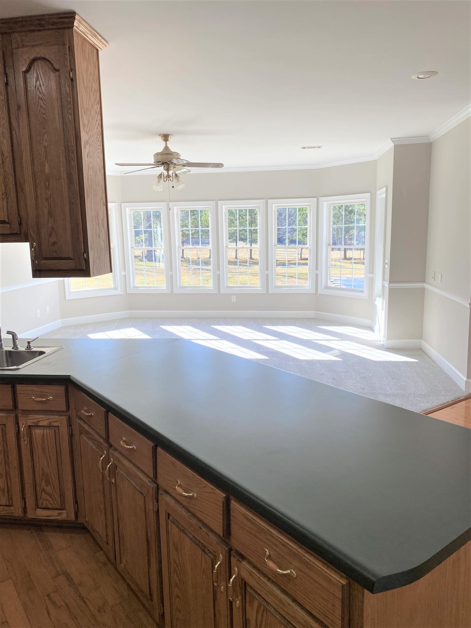 3775 Washington Road Thomson, GA 30824 - Photo 20 of 36 Kitchen open to sunny family room