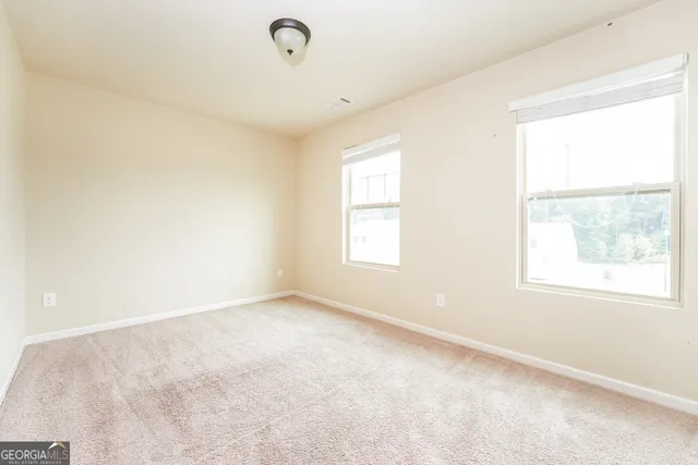 an empty room with windows