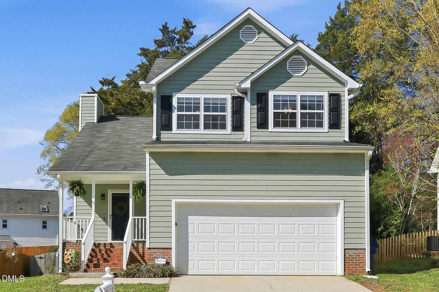 a view of a house with roof deck and couches