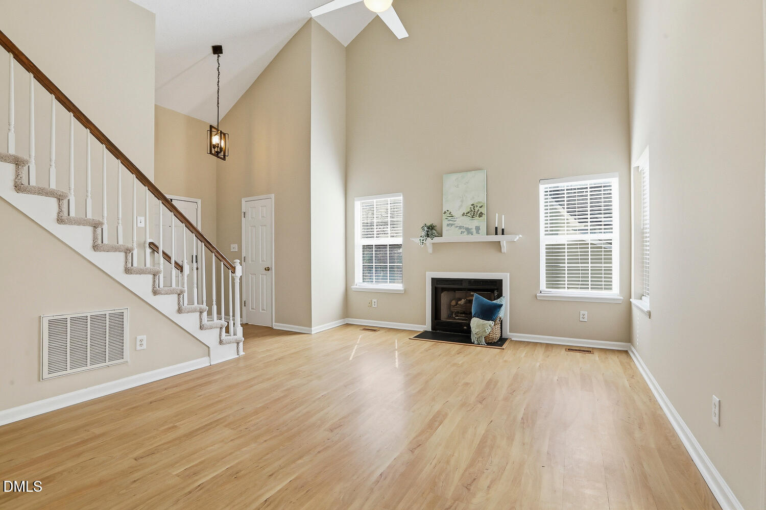 1220 Stoneferry Lane Raleigh, NC 27606 - Photo 6 of 40 a view of a livingroom with wooden floor fireplace and windows