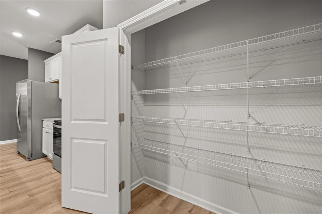 241 Epping Street, Unit 88 Stockbridge, GA 30281 - Photo 18 of 64 a view of walk in closet with empty racks