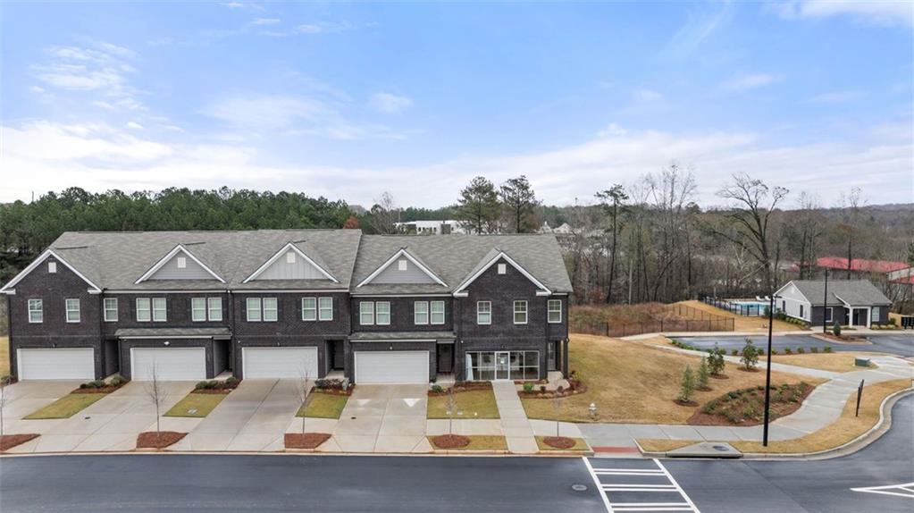 241 Epping Street, Unit 88 Stockbridge, GA 30281 - Photo 5 of 64 a view of a house with pool and chairs