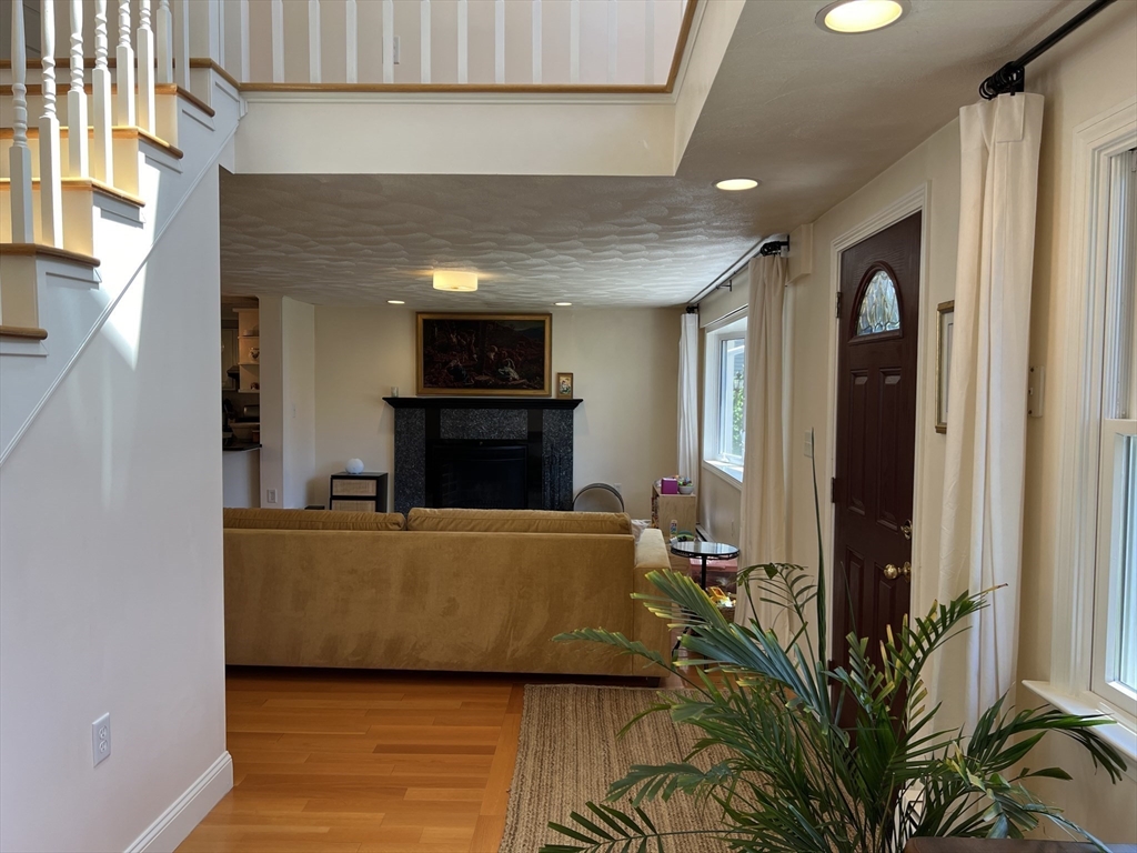 11 Garrison Road, Unit 1 Arlington, MA 02474 - Photo 16 of 42 a living room with furniture and a fireplace
