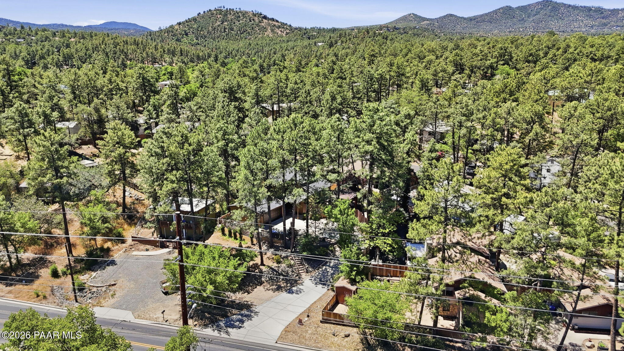 535 Copper Basin Road Prescott, AZ 86303 - Photo 4 of 41 a view of a lush green field with a tree in the background