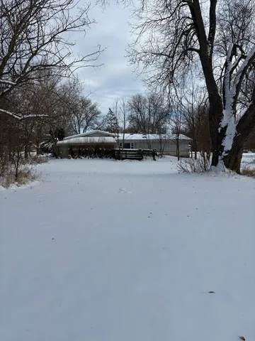 a kitchen with a sink a counter space cabinets and appliances