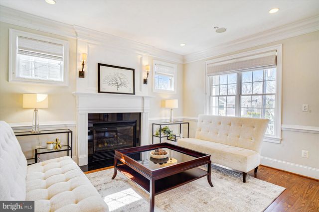 a view of a kitchen cabinets a sink and dishwasher wooden floor
