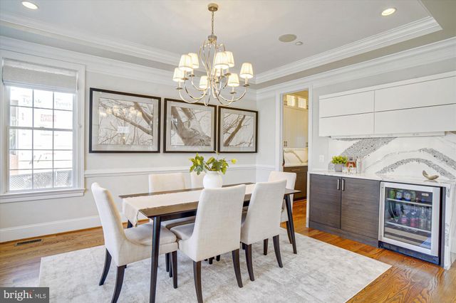 a living room with furniture and view of kitchen