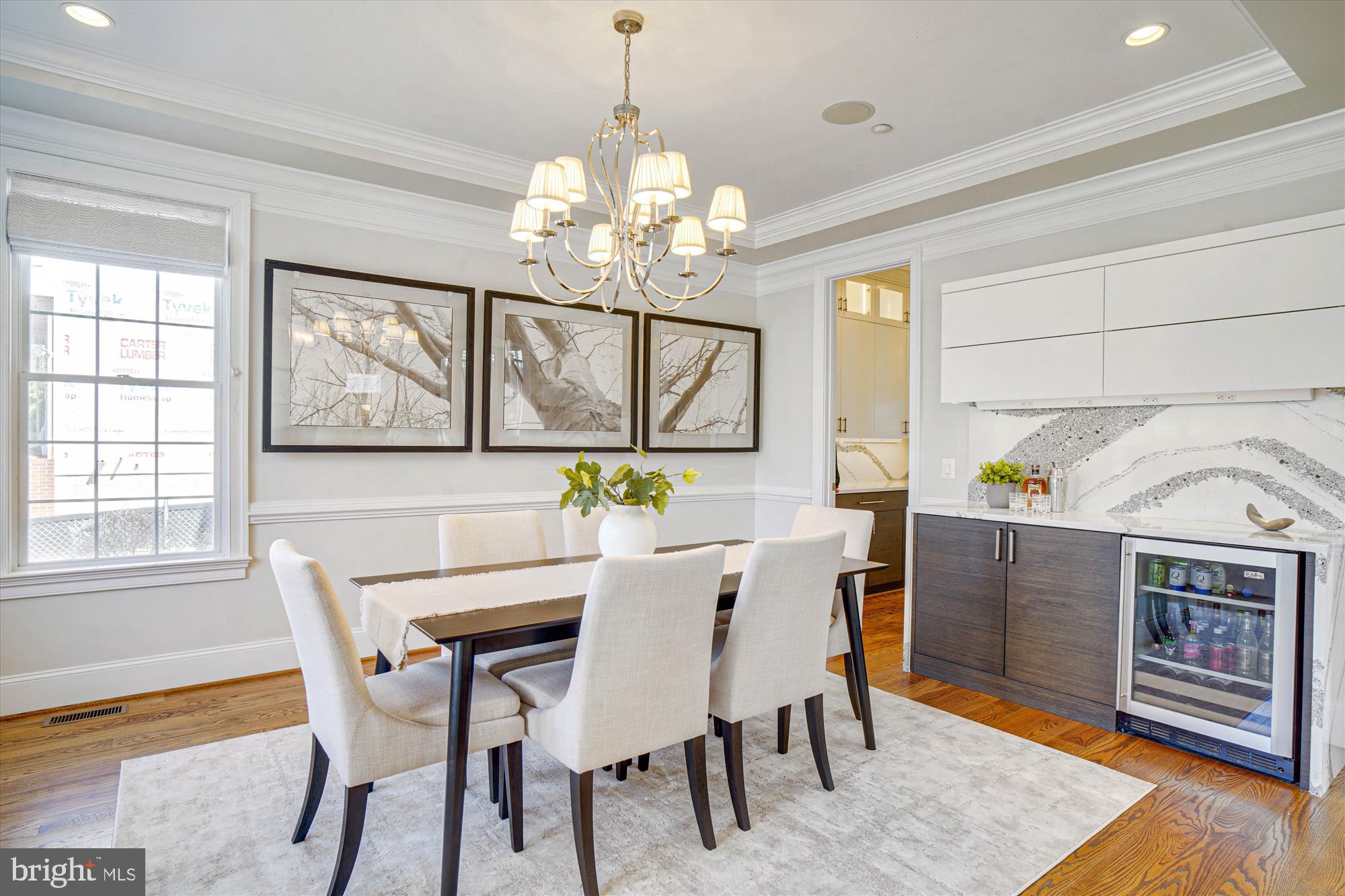 6603 Pyle Road Bethesda, MD 20817 - Photo 13 of 91 a view of a dining room with furniture a chandelier and wooden floor