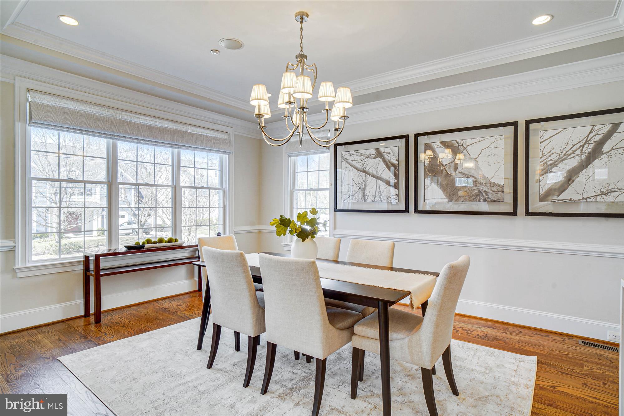 6603 Pyle Road Bethesda, MD 20817 - Photo 14 of 91 a dining room with wooden floor a chandelier a wooden table and chairs