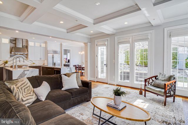 a view of a dining room with furniture large windows and wooden floor