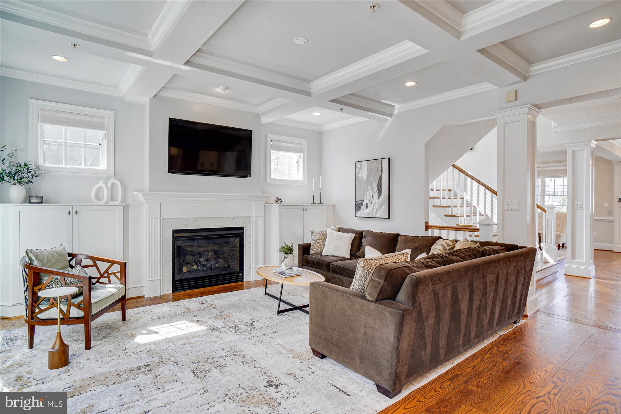 6603 Pyle Road Bethesda, MD 20817 - Photo 21 of 91 a living room with furniture a flat screen tv and a fireplace