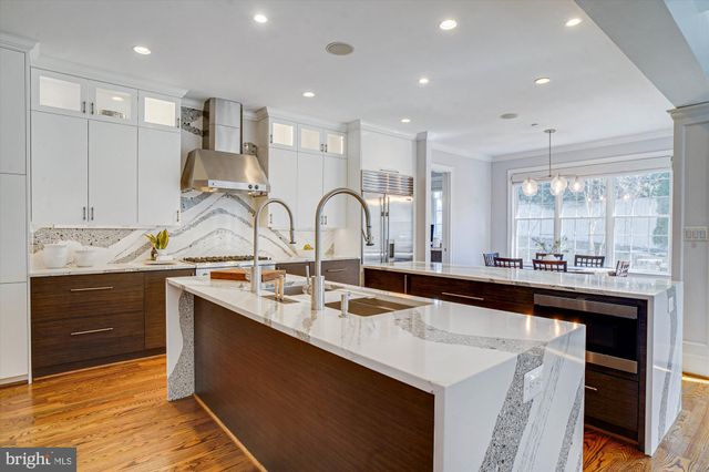 a spacious bedroom with a large bed and a fireplace