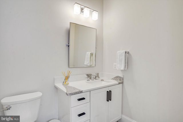 a view of entryway with wooden floor and stairs