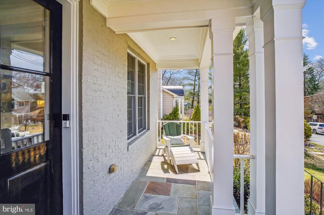 a living room with furniture a table and a fireplace