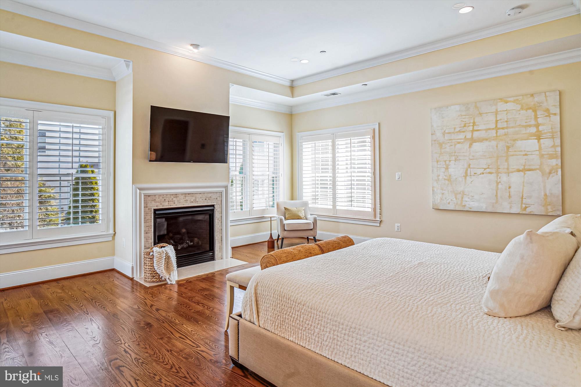 6603 Pyle Road Bethesda, MD 20817 - Photo 42 of 91 a spacious bedroom with a large bed and a fireplace