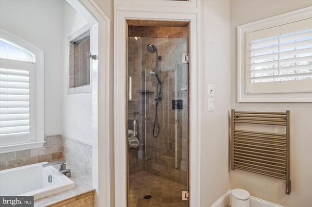 a view of hall way with furniture and stairs