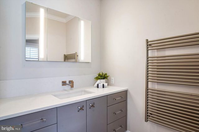 a spacious bedroom with a bed and a window